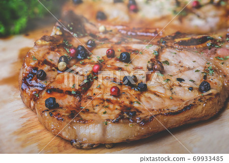 Grilled pepper pork steak with seasoning. Grilled pepper pork steak with seasoning. 69933485