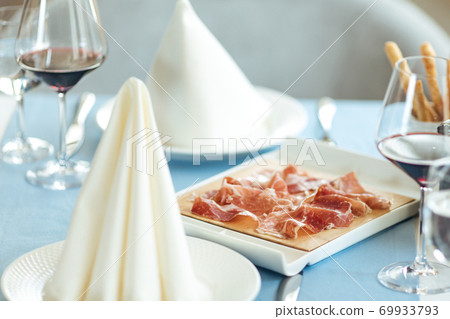 Spanish sliced pork jamon with red wine Spanish sliced pork jamon with red wine 69933793