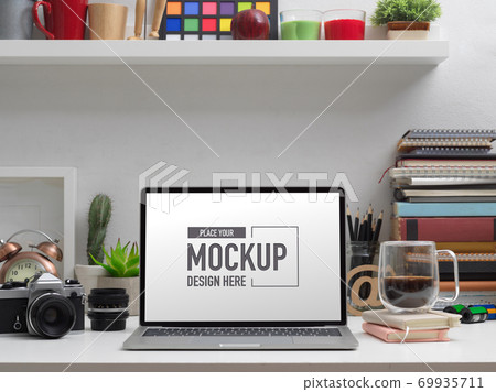 Mock up laptop on study table with school elements and decorations 69935711