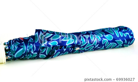 Folded compact umbrella in Dotted Steelblue color cover isolated on white background Folded compact umbrella in Dotted Steelblue color cover isolated on white background 69936027