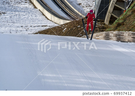 ski jumper while jumping 69937412