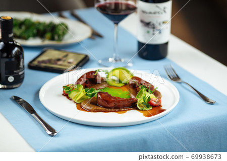 Lamb tongues with caramelized onion puree 69938673