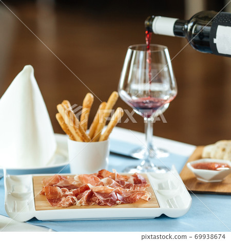 Spanish sliced pork jamon with red wine Spanish sliced pork jamon with red wine 69938674
