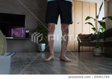 Man doing yoga in the room Man doing yoga in the room 69941749