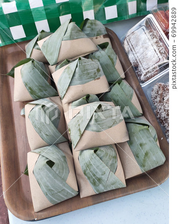 Nasi lemak. Is a signature food in Malaysia. Often eaten as breakfast. Nasi lemak is usually served with sambal, eggs and anchovies. Nasi lemak. Is a signature food in Malaysia. Often eaten as breakfast. Nasi lemak is usually served with sambal, eggs and anchovies. 69942889