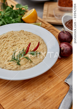 Many different spices, vegetables and ingredients, and fresh herbs for making homemade sauce Many different spices, vegetables and ingredients, and fresh herbs for making homemade sauce 69942994