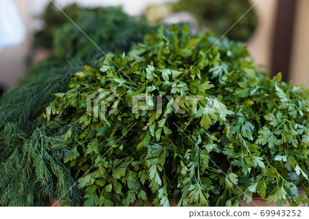 Fresh parsley, dill, sorrel are sold in the market. Lifestyle healthy food concept. 69943252