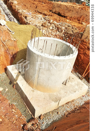 SEREMBAN, MALAYSIA -AUGUST 6, 2020: Utility services manhole and underground pipes under construction at the construction site. In-situ construction by workers based on infrastructure engineer design. 69944338