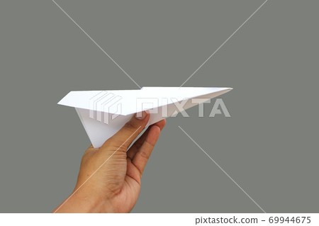 paper plane in a hand paper plane in a hand 69944675