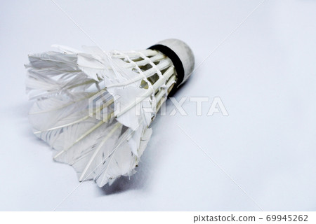 Shabby shuttlecock. Some of the feathers have been damaged and lost. Shabby shuttlecock. Some of the feathers have been damaged and lost. 69945262