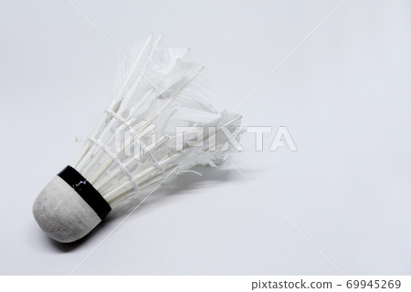 Shabby shuttlecock. Some of the feathers have been damaged and lost. 69945269