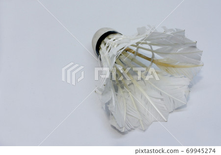Shabby shuttlecock. Some of the feathers have been damaged and lost. Shabby shuttlecock. Some of the feathers have been damaged and lost. 69945274