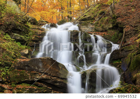 Landscape of waterfall in the Ukrainian Carpathian Mountains on the long exposure in autumn Landscape of waterfall in the Ukrainian Carpathian Mountains on the long exposure in autumn 69945532