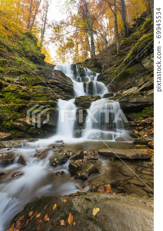 Landscape of waterfall in the Ukrainian Carpathian Mountains on the long exposure in autumn Landscape of waterfall in the Ukrainian Carpathian Mountains on the long exposure in autumn 69945534