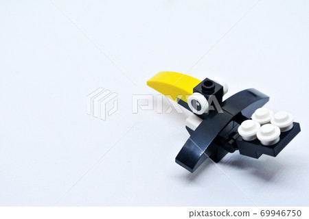 The shape of a crow is made of colorful plastic toy blocks. The shape of a crow is made of colorful plastic toy blocks. 69946750
