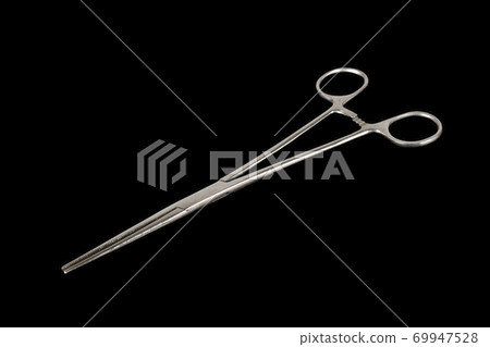 Forceps isolated on a black background 69947528