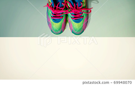 Pair of sport shoes with pink laces 69948070