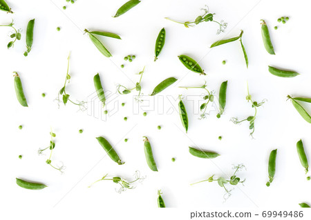 Flat lay natural light green snap peas isolated on white Flat lay natural light green snap peas isolated on white 69949486