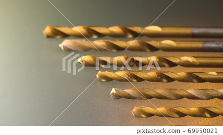 Drill bit set on frosted glass background Drill bit set on frosted glass background 69950021