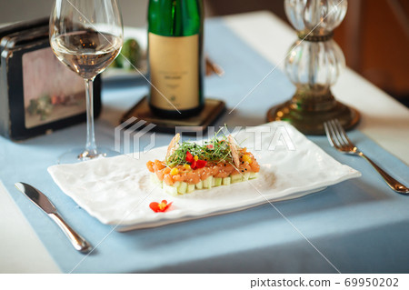 Side view on spanish salmon tartare on avocado 69950202