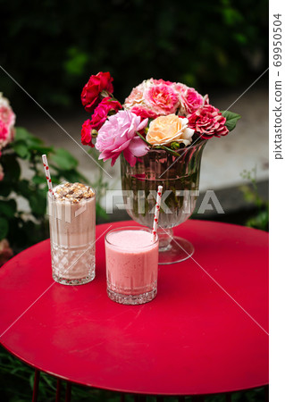 Side view on chocolate and strawberry milkshakes Side view on chocolate and strawberry milkshakes 69950504
