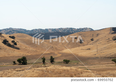 The San Luis Creek and valley during dry and hot season, California, USA The San Luis Creek and valley during dry and hot season, California, USA 69950702