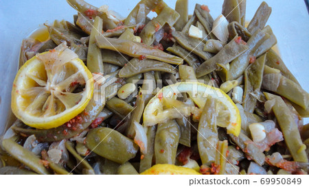 Healthy homemade traditional food Turkish traditional cuisine Green Beans (Zeytinyagli Fasulye ) with oliveoil, lemon and onion Healthy homemade traditional food Turkish traditional cuisine Green Beans (Zeytinyagli Fasulye ) with oliveoil, lemon and onion 69950849