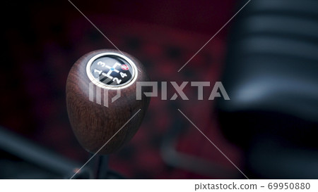 The interior of the car. Footage. Sports classic car manual transmission wooden handle The interior of the car. Footage. Sports classic car manual transmission wooden handle 69950880