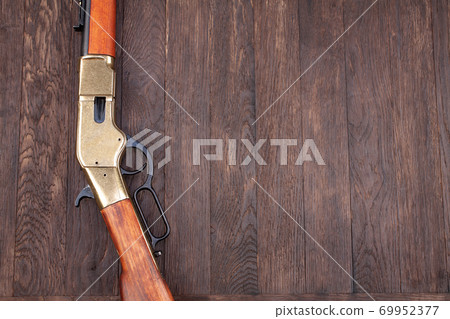 Old west gun - lever-action repeating rifles with ammunition 69952377