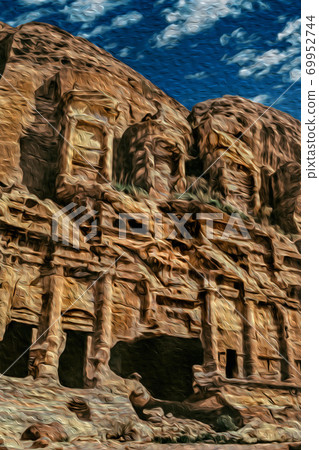 Facade of worn temple carved on rock in Petra 69952744