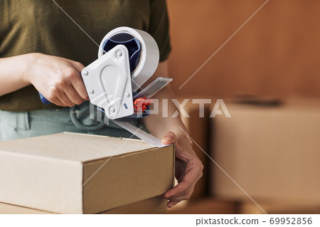Woman packing packages 69952856