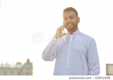 Man talking on the phone Man talking on the phone 69952896