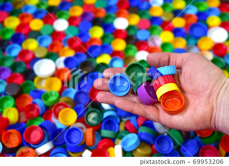 Plastic bottle caps background. Waste cap material Plastic bottle caps background. Waste cap material 69953206