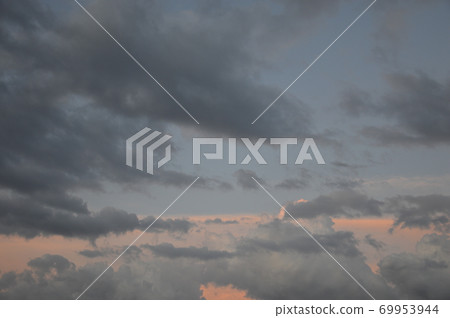 Colorful rain clouds at sunset 69953944