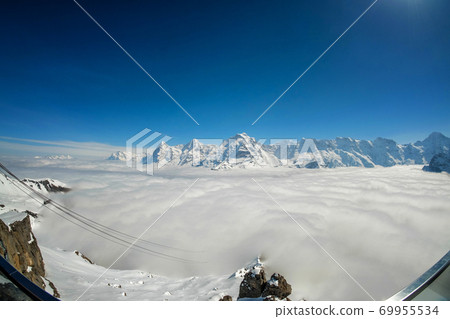 Stunning Panoramic view Snow moutain of the Swiss Skyline from Piz Gloria Schilthorn, Switzerland 69955534
