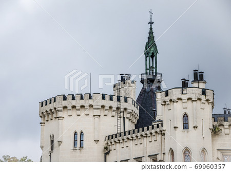 White towers of the 13th-century Hluboka Castle situated in Hluboka nad Vltavou, Czech Republic White towers of the 13th-century Hluboka Castle situated in Hluboka nad Vltavou, Czech Republic 69960357