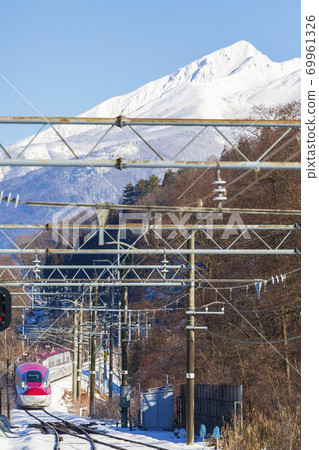 Mt. Akita Komagatake and Akita Shinkansen Komachi in winter, Semboku City, Akita Prefecture Mt. Akita Komagatake and Akita Shinkansen Komachi in winter, Semboku City, Akita Prefecture 69961326