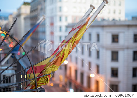 Concept of protest suspended, rolled flag on balcony of building Concept of protest suspended, rolled flag on balcony of building 69961867