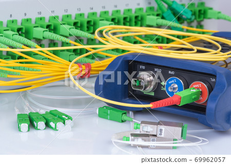 Optical Power Meter and Network of Fiber Patch Cord with Distribustion Frame Closeup 69962057