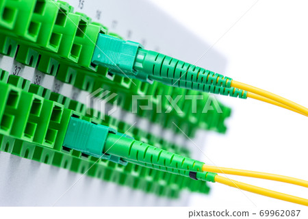 Optical distribution frame with connected patch cord close-up isolated on white background 69962087