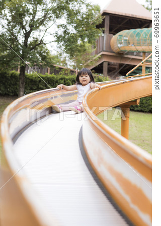Children playing with playground equipment at Oita Agricultural Culture Park Children playing with playground equipment at Oita Agricultural Culture Park 69963651