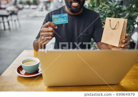 Happy person looking satisfied with online shopping Happy person looking satisfied with online shopping 69964979