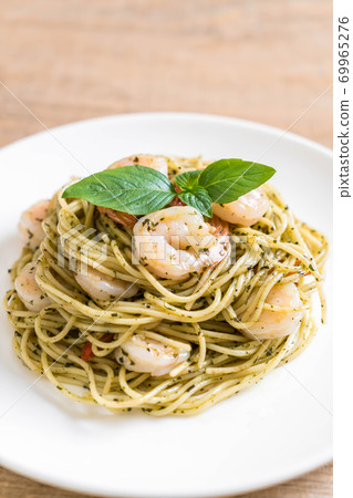 pasta spaghetti with pesto green and shrimps pasta spaghetti with pesto green and shrimps 69965276