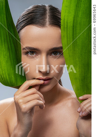 Sexy Caucasian woman looking at the camera in photo studio Sexy Caucasian woman looking at the camera in photo studio 69965643