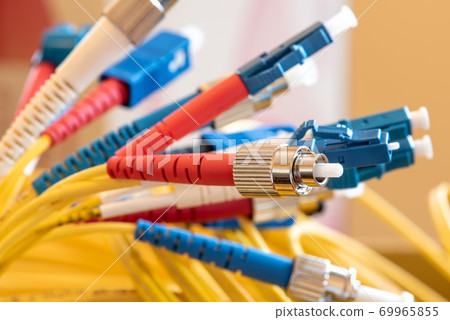 Fiber optic patch cord with connectors close-up Fiber optic patch cord with connectors close-up 69965855
