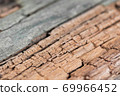 Old wooden plank background with selective focus.  69966452