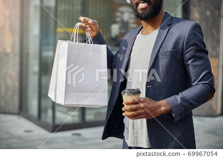 Close up of cheerful man that walking with pleasure 69967054