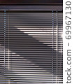 Blinds illuminated through daylighting windows 69967130