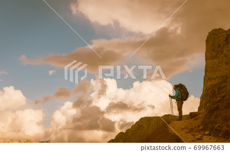 hiker on footpath Sella Ronda mountain south Tyrol hiker on footpath Sella Ronda mountain south Tyrol 69967663