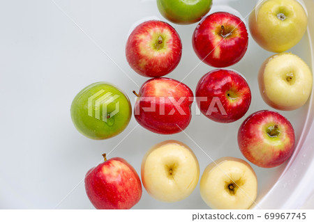 Washing fresh apples in the water Washing fresh apples in the water 69967745